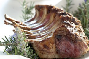 Braaied rack of lamb, herbed brinjals and dhai.